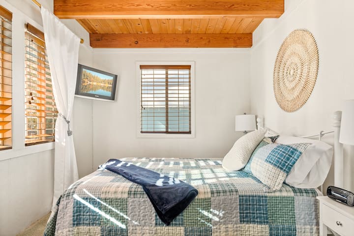 Bedroom #2: This downstairs bedroom has 1 queen bed, carpet floor, a closet, and a Fire TV with streaming services.