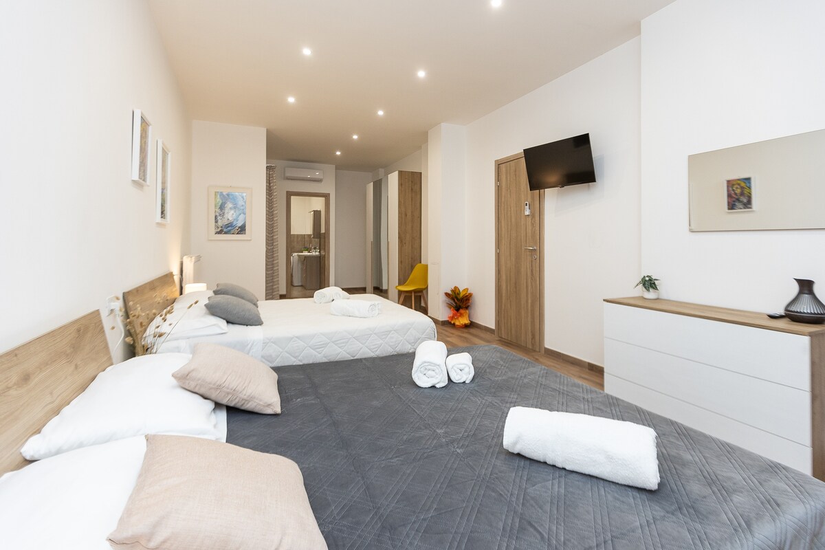  vierpersoonskamer met 2 comfortabele dubbele hectare en een eigen badkamer