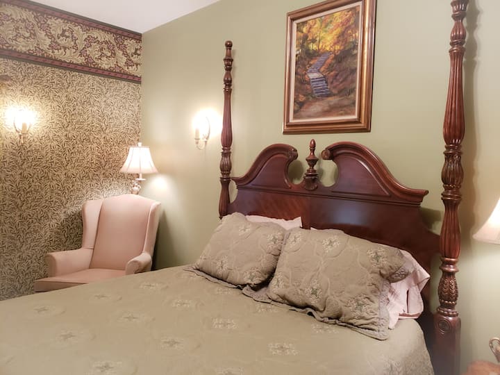 Our Meadow Room has a queen bed, a private washing-up sink, and a library. It shares a bath with the Sunrise Room.