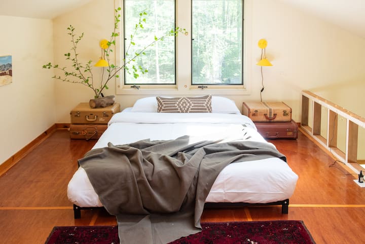 Wake up with the sun beneath the tree tops in the loft!