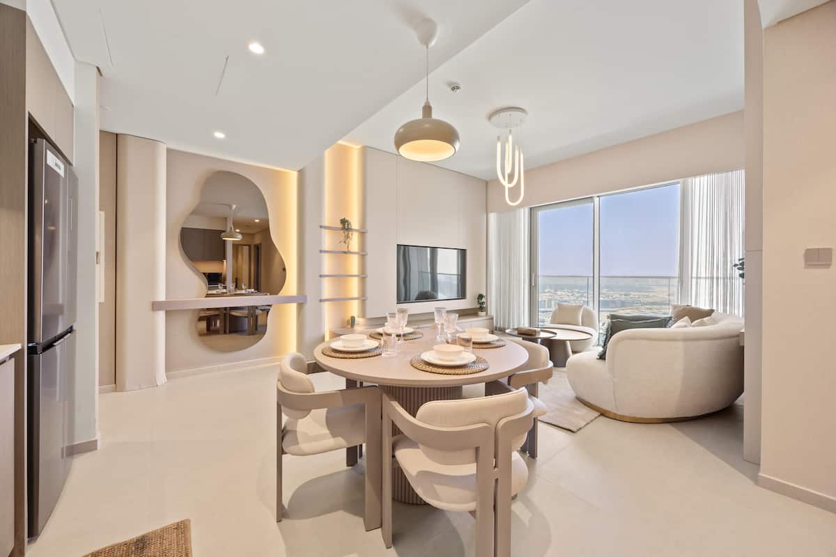 Open-plan dining and living area in our 2-bedroom that sleeps 4
