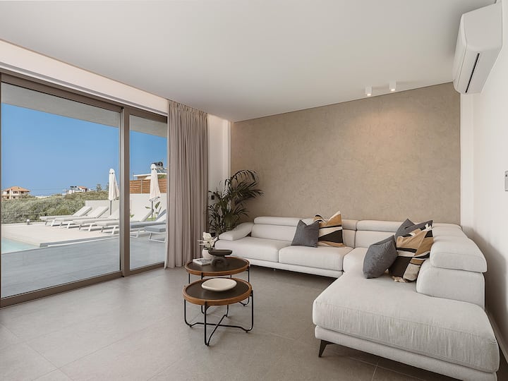 Open-plan living room with Smart TV & pool views