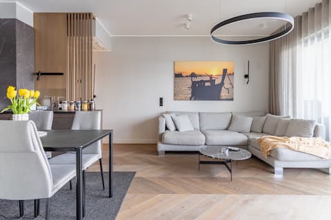 Family apartment by the river, large balcony, free parking.