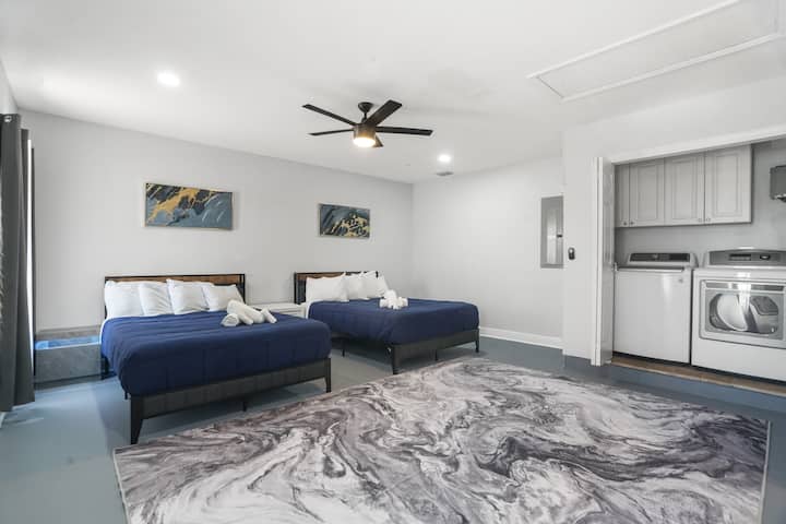 Bedroom 1 with two queen beds and smart TV