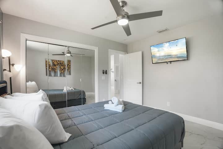 Queen bed with storage for clothing and Smart TV