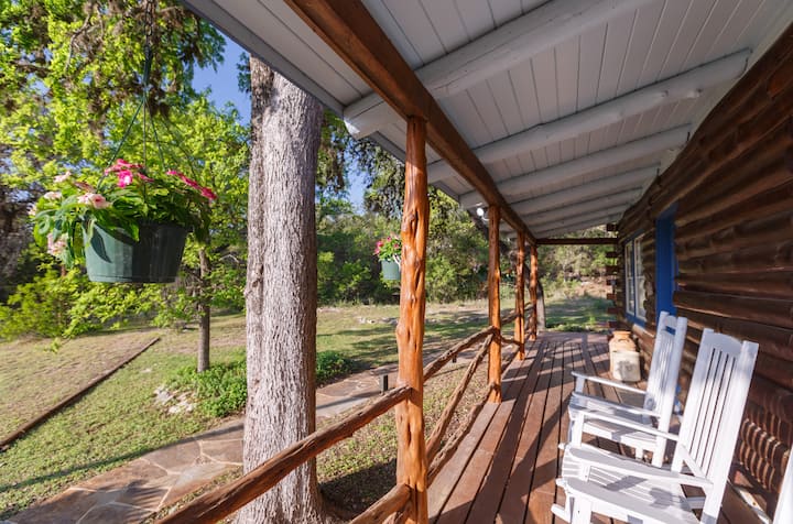 You just can't ask for a better vacation vibe than front porch rocking chairs at a log cabin.