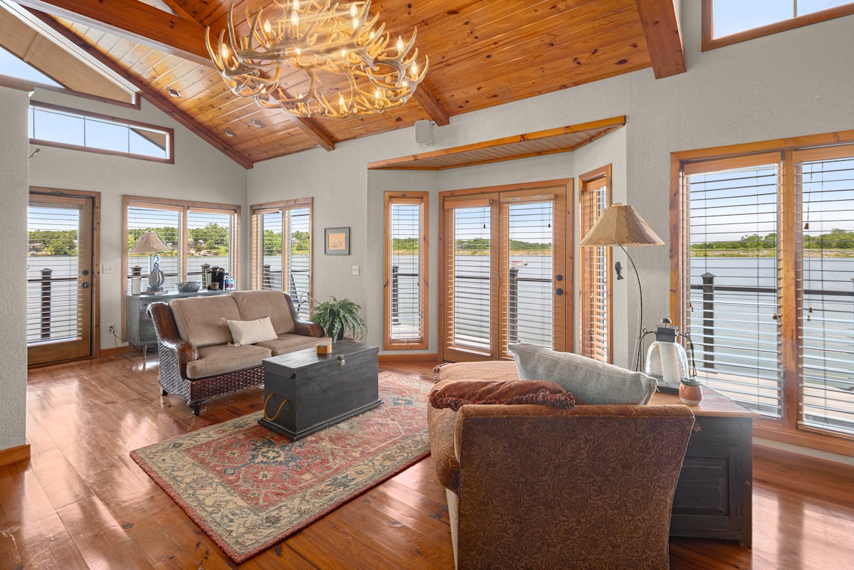 This private boat house has a king size bed, lounge chairs in the living space, full bathroom with bathtub, fire place, outside deck chairs and your own Keurig and K-cups!