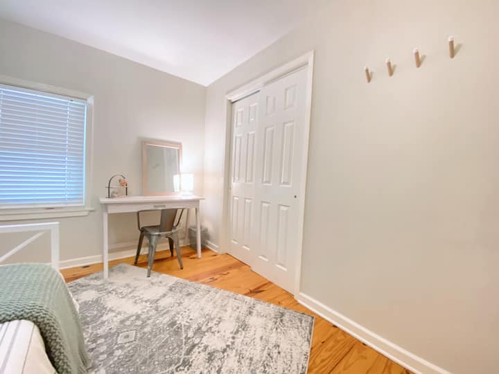 This dreamy bedroom is the perfect place to unwind, featuring a plush bed, soft lighting, calming neutral tones, and newly added curtains for extra comfort and privacy. Whether you’re reading or catching up on sleep, it’s a perfect peaceful retreat.