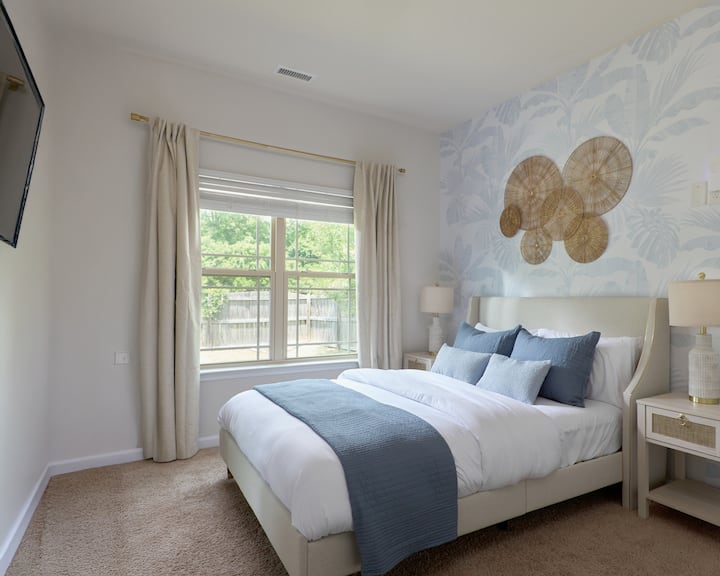 The Botanical Room is Bedroom #1 on the first floor, featuring a comfortable bed for a relaxed, garden-inspired experience. Optional dedicated work space desk and chair also available. 43" Smart TV with Disney Plus Hulu, Netflix, YouTube and others.