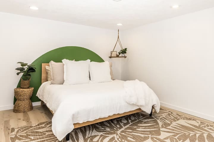 The master bedroom features a king size bed. There is a queen size blowup mattress in the closet. The beach gear (beach wagon, 4 chairs, umbrella and pool toys) is also stored in the master bedroom closet along with a pack n play and sheets.