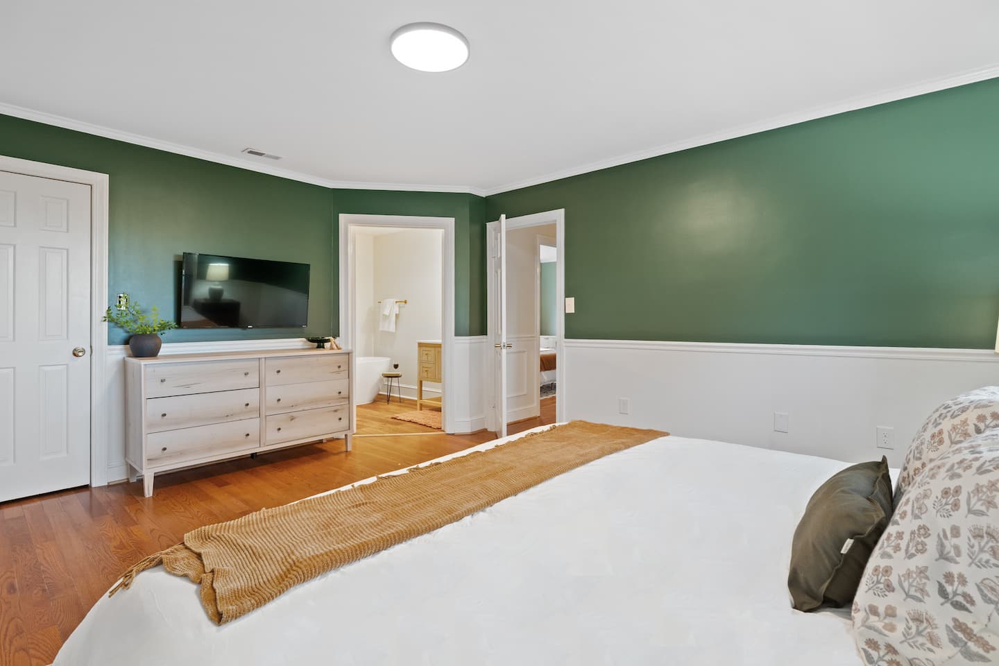 Bedroom with green accent wall