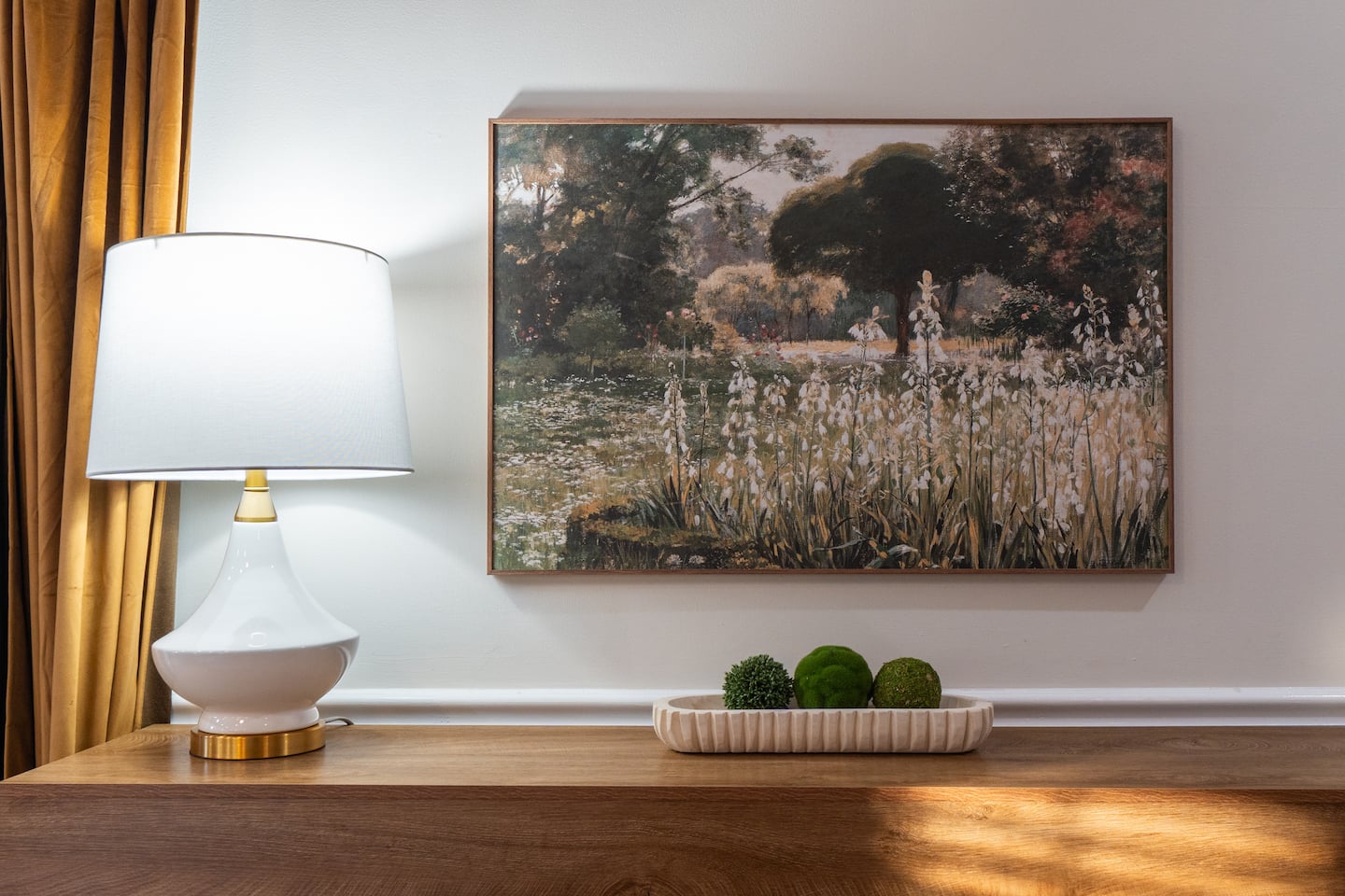 Living room accent table with lamp and art