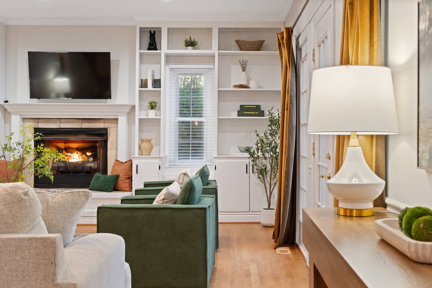 Living room with built-in shelving and fireplace