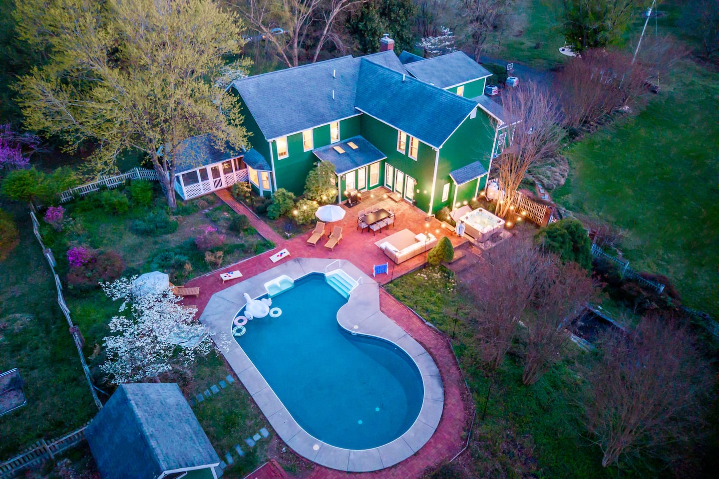 Emerald Retreat at twilight, pool and patio glowing
