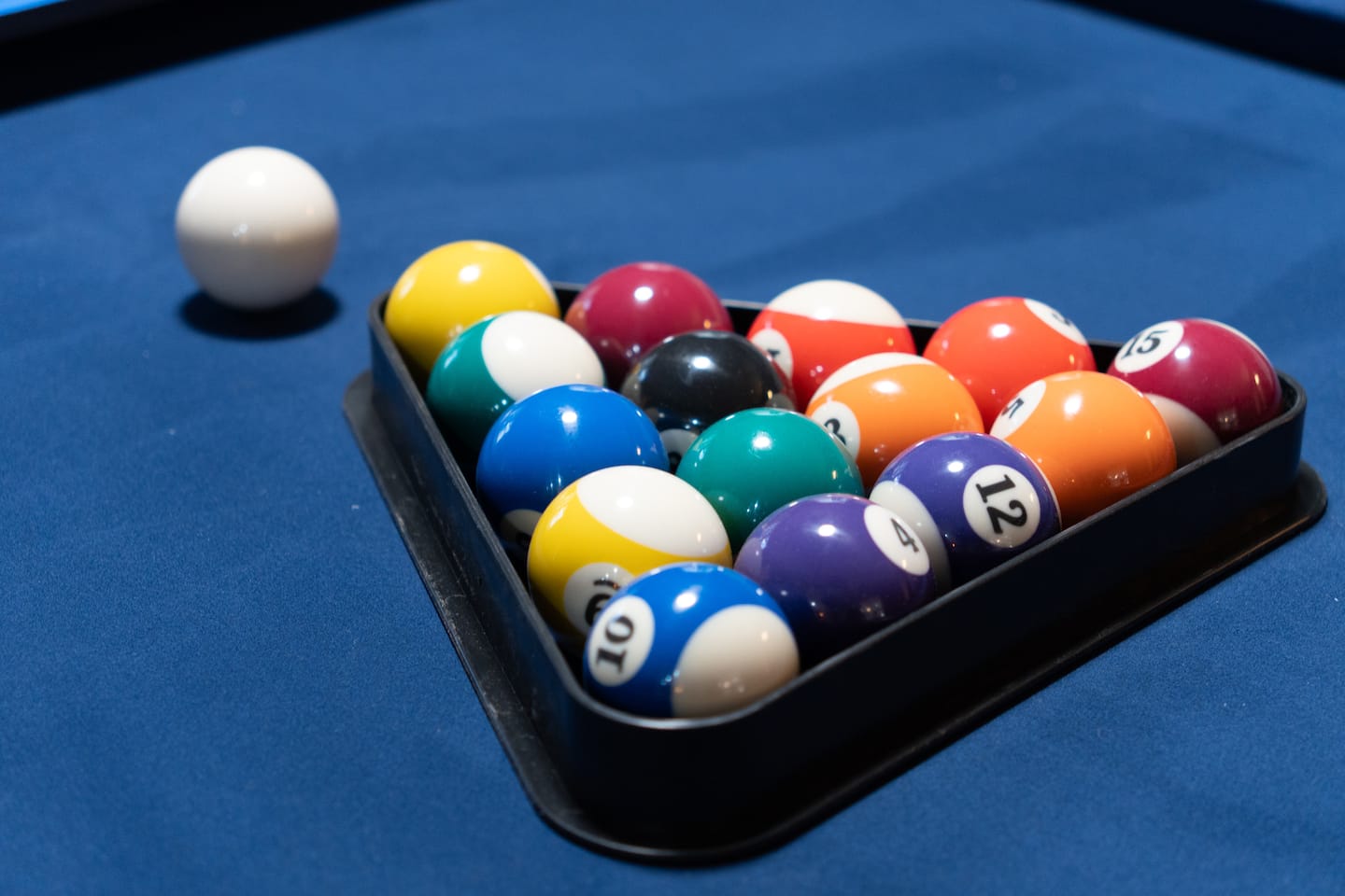 Pool table balls racked and ready