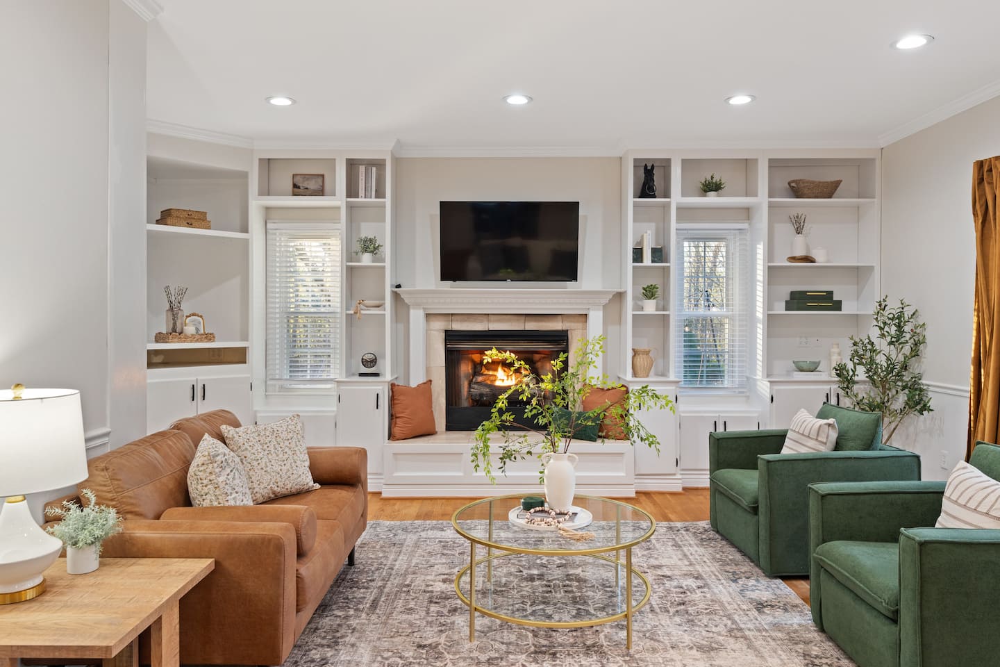 Photo 14 — Living room with sectional and gas fireplace