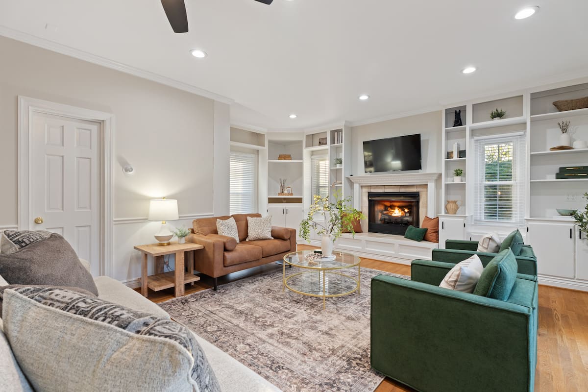 Living room with sectional and second fireplace