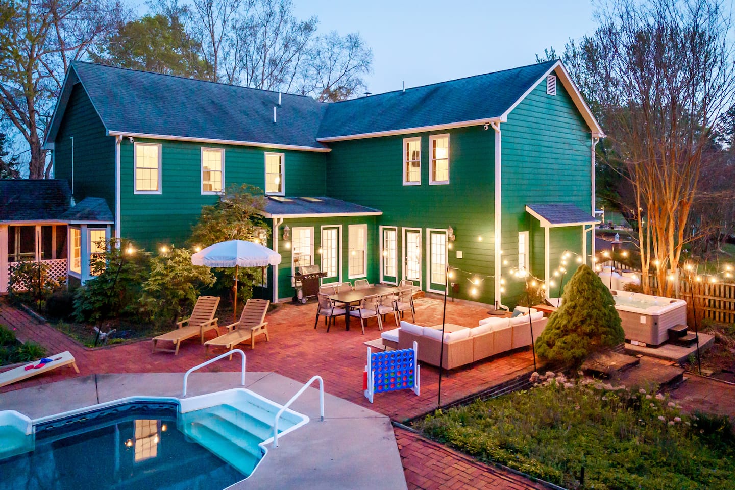 Pool and patio lit at dusk