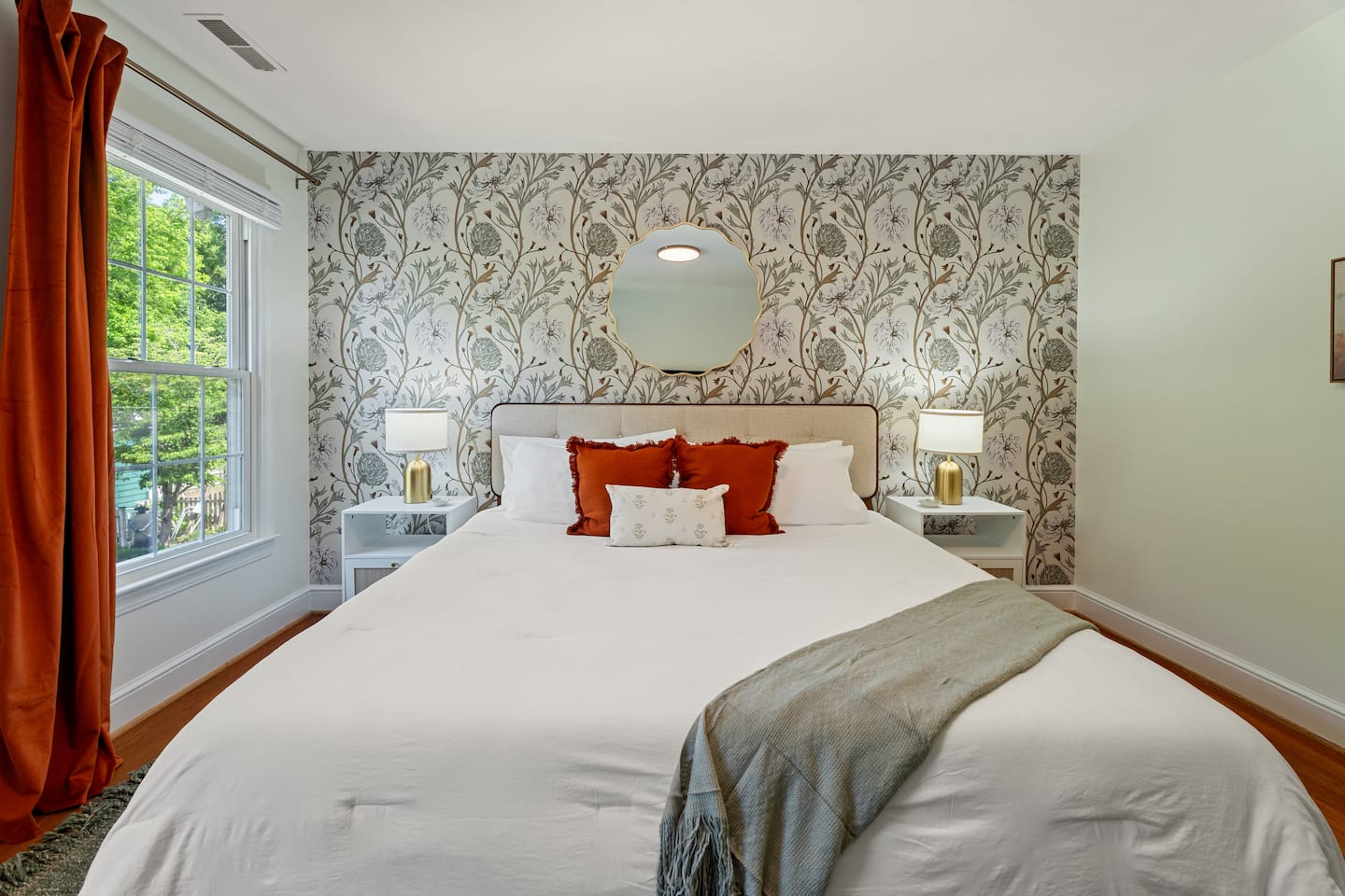 Bedroom with floral wallpaper accent