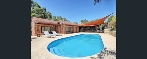 Poolside Comfort Near City 5BR