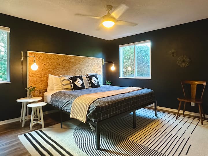 The second en suite bedroom is located at the opposite corner of the house from the primary bedroom. All three bedrooms feature king beds.