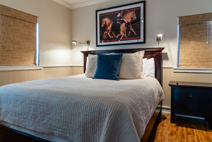 The king-sized bed and large, flat screen TV make the bedroom suite a terrific hideaway to come home to.