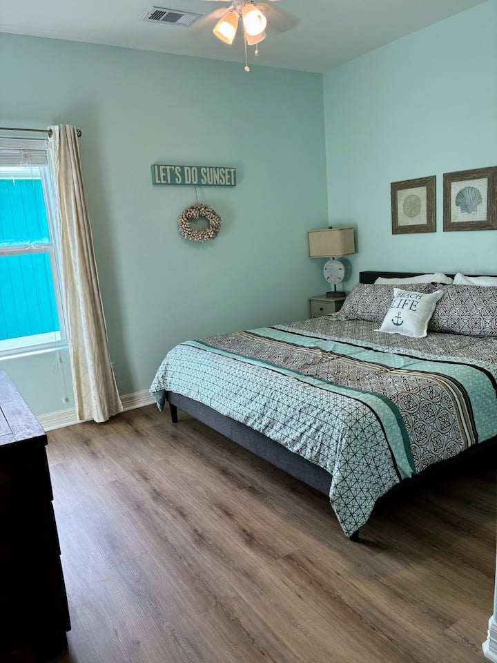 Second king bedroom with smart TV and cozy coastal vibe.