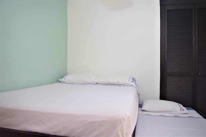 Kangaroo bed, i.e. double bed and single bed downstairs; blankets, towels, closet, fan and minisplit (Cold and hot)