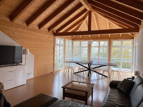 Apartment with a sauna and a view of the forest