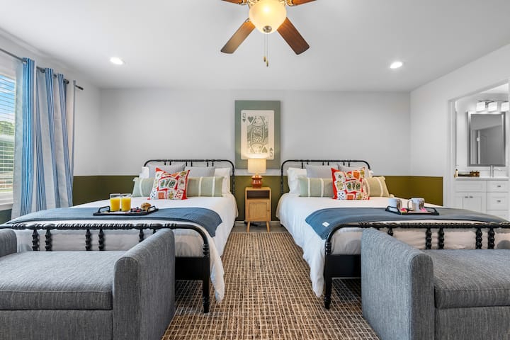 This cozy room features two queen beds, perfect for groups or families who want to stay together in style.