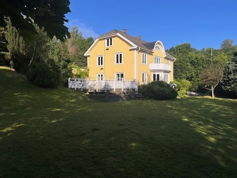 Large turn-of-the-century house near Gothenburg, in a park environment