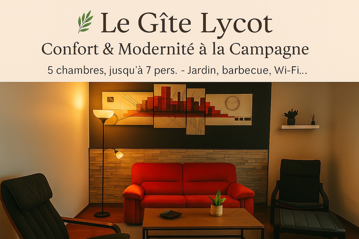 A welcoming living area features two comfortable armchairs and a modern floor lamp, creating a relaxed seating arrangement. The wall is adorned with minimalist artwork, while soft lighting provides an inviting ambiance. A glimpse of the garden can be seen through a nearby window.