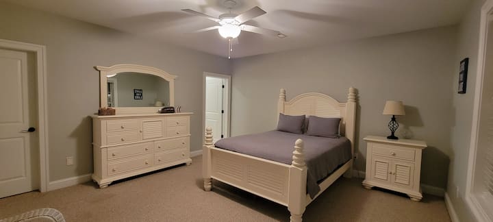 The bedroom on the terrace level has a queen-sized bed, spacious closet, dresser and a private full bathroom! Perfect!