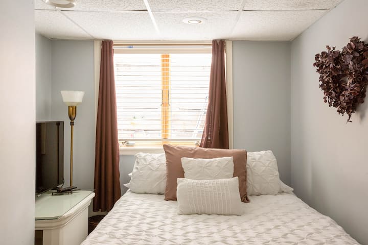 Full size bed in the smaller room, including 4K, HD TV.