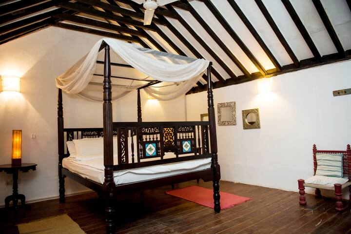 This is the upper loft area of one of the bedrooms. The lower level has a king bed while up the stairs leads to this loft open area with a queen bed. It's a great bedroom for a family or group of friends as it has two connected bedrooms areas.