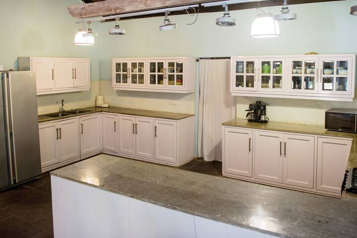 It's a large open kitchen with a microwave and all basics - most importantly the house comes with a great full time cook.