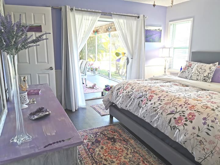 Light-filled lavender bedroom, soft as a seaside sunset. The super-comfy bed drifts you into dreams, then opens onto the Pondview Terrace — where mornings arrive with a salty breeze and birdsong. 