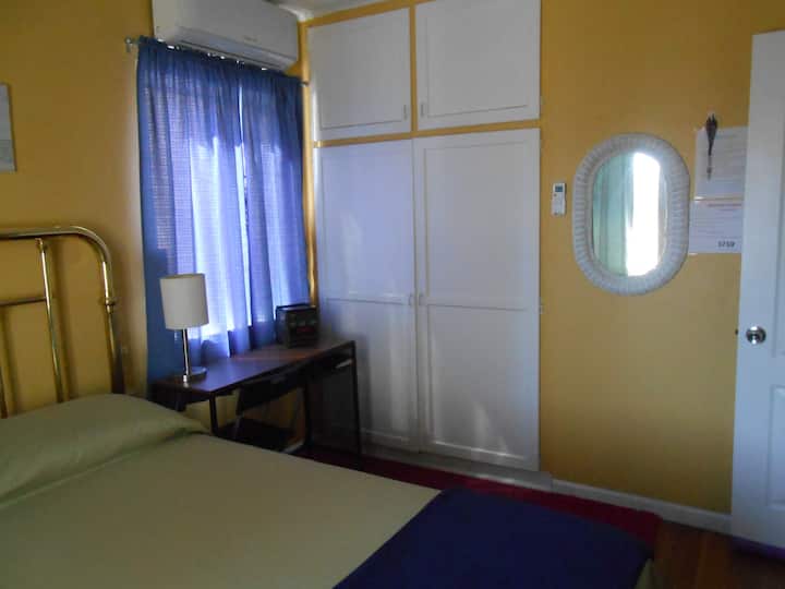 Desk and Closet. Inside is the flat iron and ironing board & extra chair.