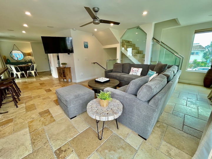 Taking the stairs to the second level you will see this living space opened up to the kitchen.
