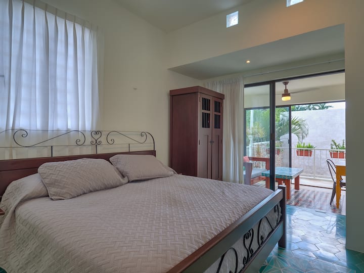 Master bedroom has a king sized bed and an en suite bathroom as well as its own private sunroom and terrace.