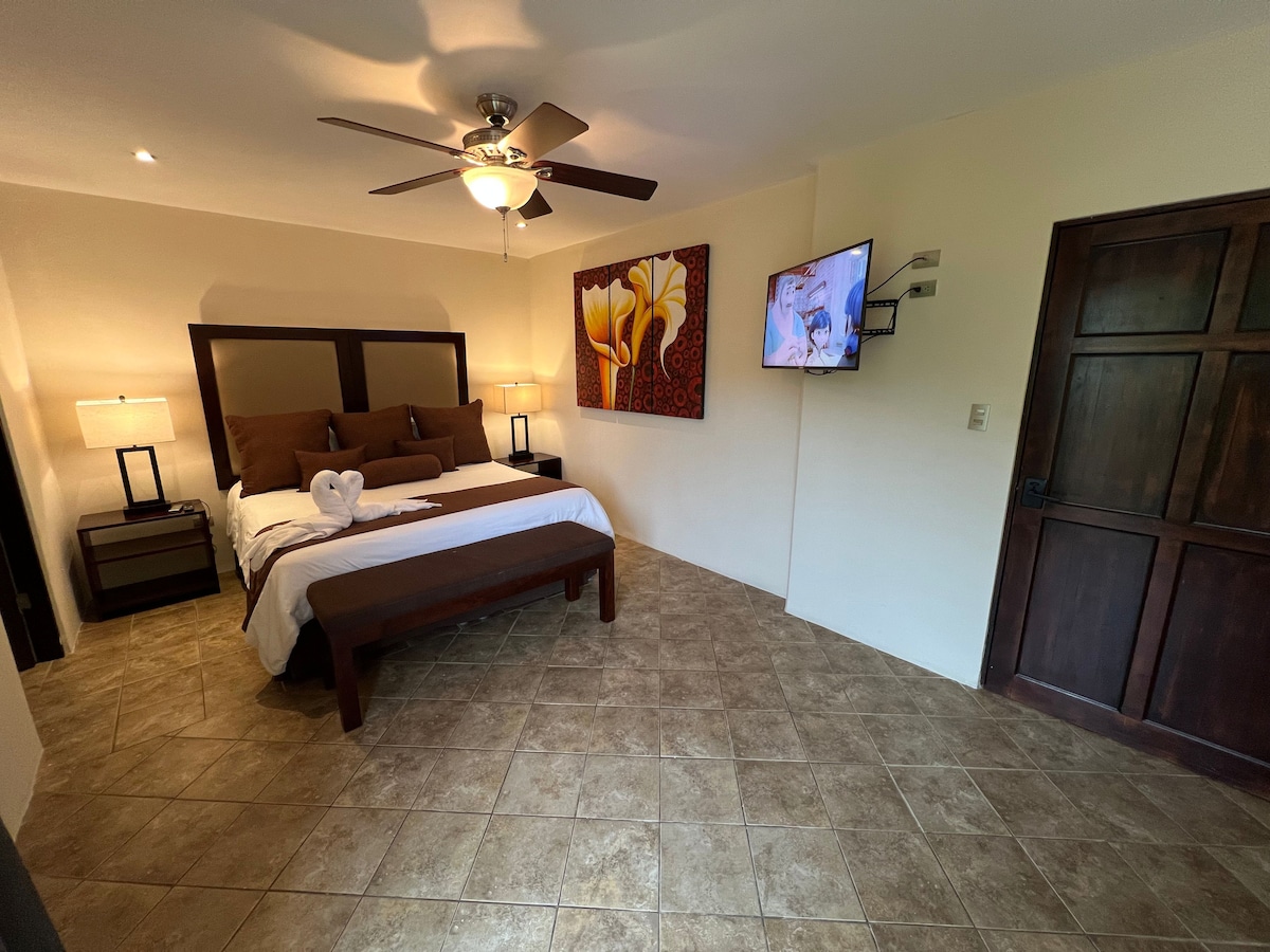 Bedroom with king bed. 