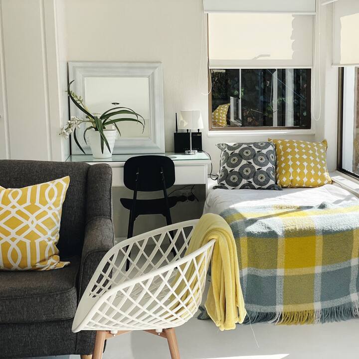 Downstairs bedroom with two single beds and one fold out mattress