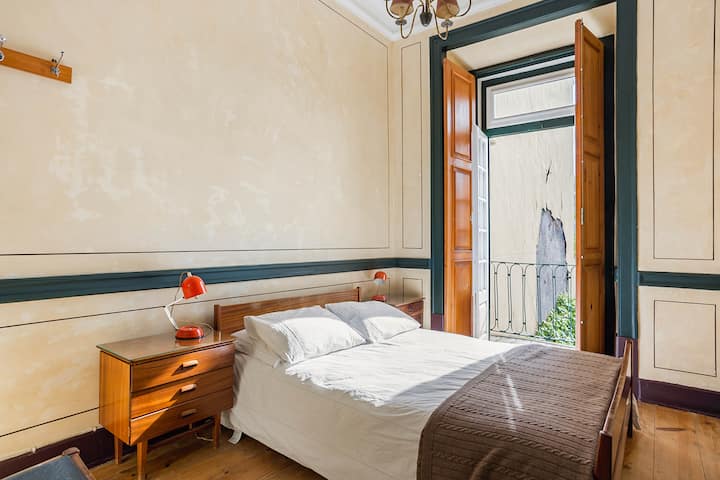 The Olaio room with typical Portuguese 1960s Olaio furniture. Natural latex mattress and Made In Portugal cotton sheets and a Dona Manta woollen blanket bought at Paris em Lisbon in Chiado.