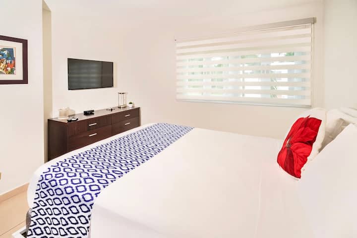 Bedroom #3 with comfortable queen bed and flatscreen TV.