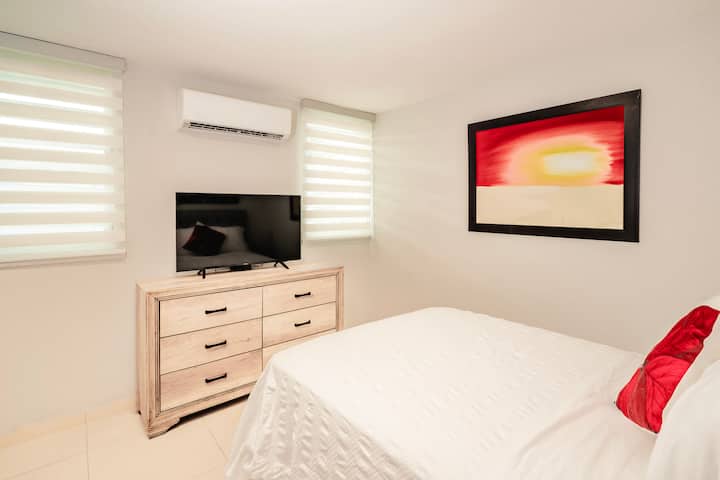 Bedroom #4 with comfortable full bed and Smart TV.