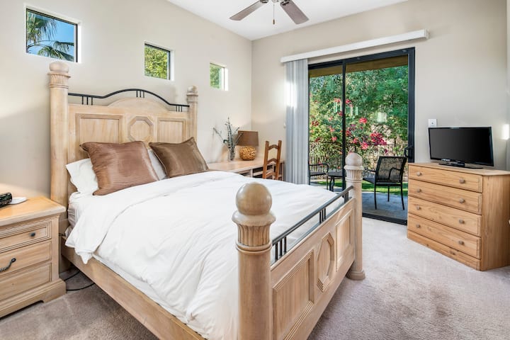 Bedroom #5 located in the guest house with a private patio. 1 Queen bed.