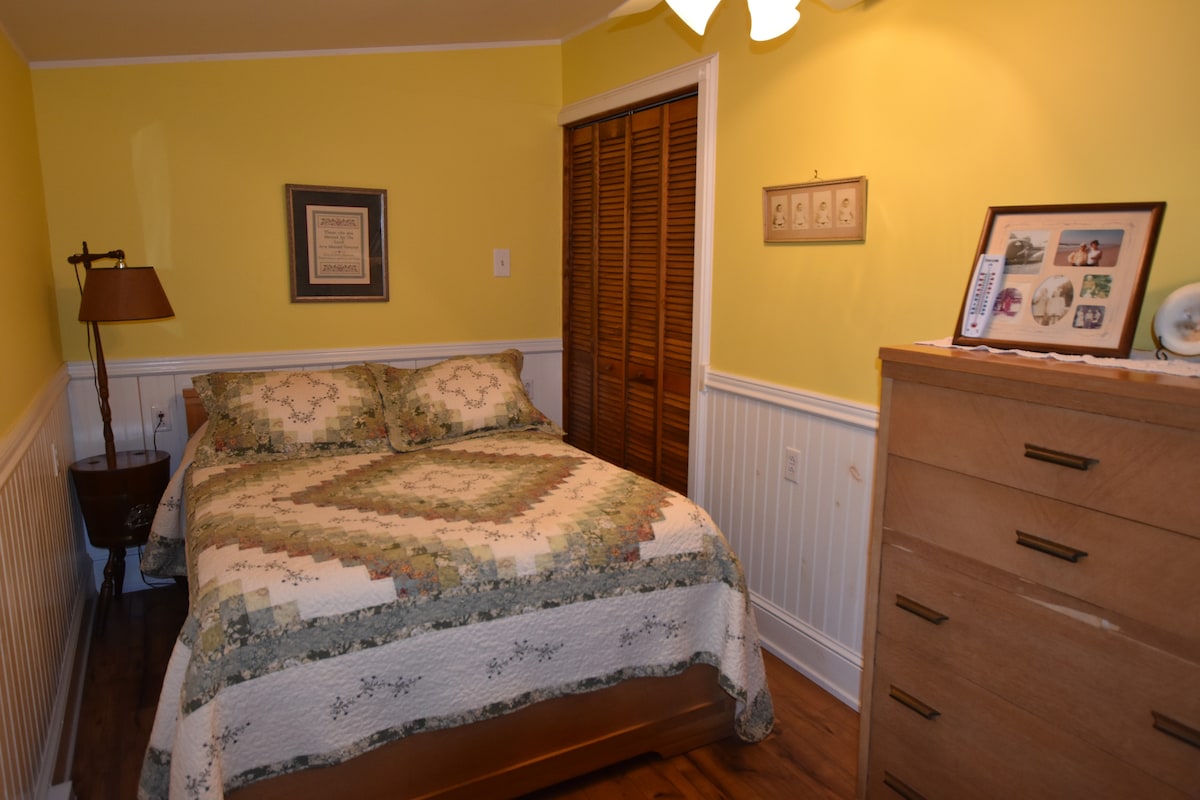 Downstairs - One of the three bedrooms.