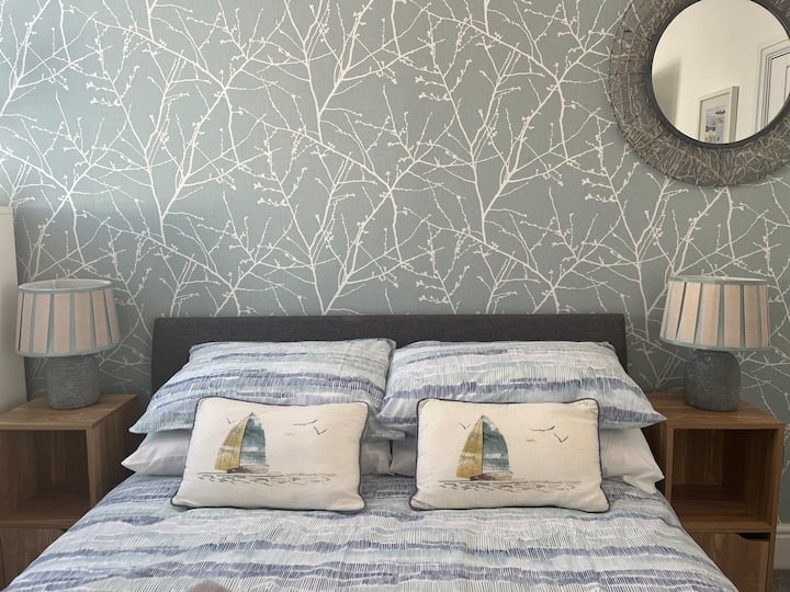 newly decorated Second bedroom with double bed, bedside units, drawers and hanging space