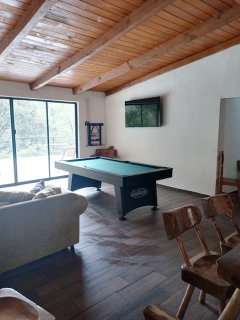 CABERNET PINOS DEL RIO CABIN NEXT TO A WATERFALL