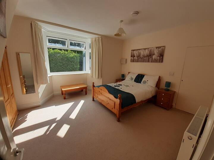 Large double bed room with plenty of storage.